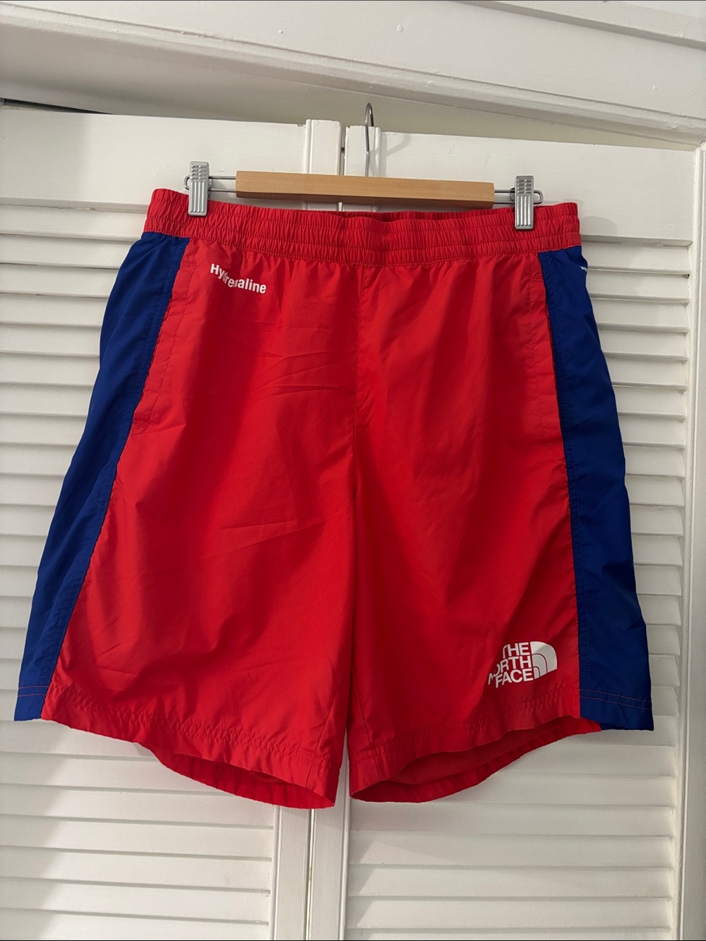 The North Face Men's Red Shorts with Blue Side Panels
